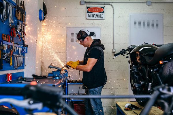 motorcycle-mechanic-using-a-grinder-B3JSF5V-resize.jpg